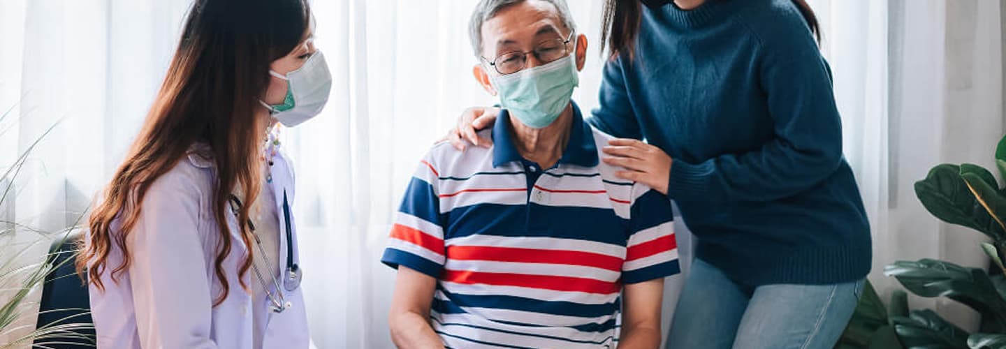 Caregiver wearing protective equipment
